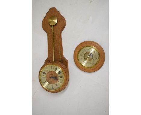 Light oak-cased wall timepiece, 70cm high, together with a similar aneroid barometer, 25.5cm diameter (2)  