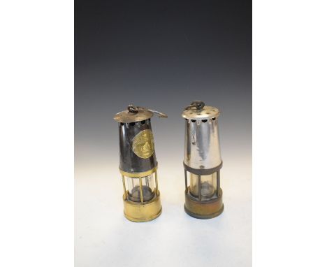 Two miners lamps, one marked Protector Lamp and Lighting Company Eccles Manchester type Sl  