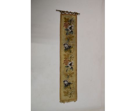Needlework tapestry hanging, 24cm wide x 123cm high excluding brass hanging rail  
