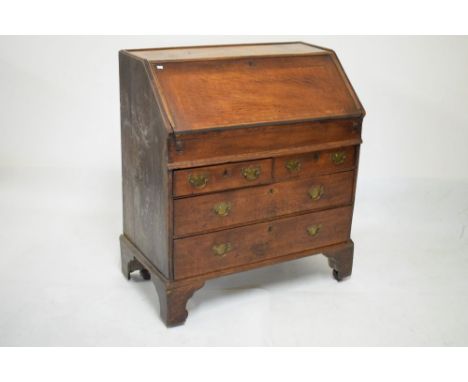 Mid 18th Century oak bureau fitted drawers and pigeon holes over retractable well, the front of two short and two long drawer