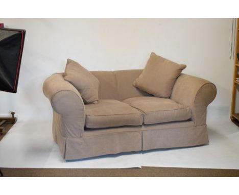 Two modern Chesterfield-style settees or sofas, each with pale brown Hessian-style loose cover and scatter cushions, comprisi