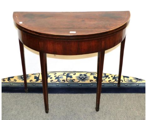 A George III inlaid mahogany demi-lune fold over card table 90cm by 44cm by 70cm