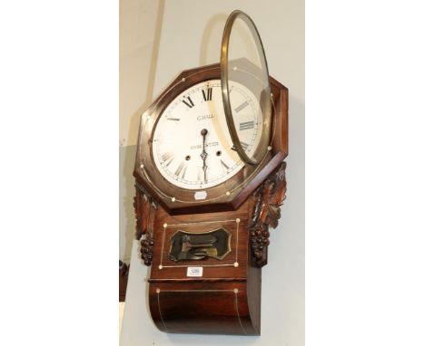 A late 19th century rosewood and mother-of-pearl inlaid striking drop dial wall clock with carved decoration to the surround 