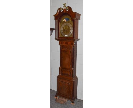 A George III oak and mahogany eight-day longcase clock, with brass arch top dial, silvered chapter ring, moon roller and two 