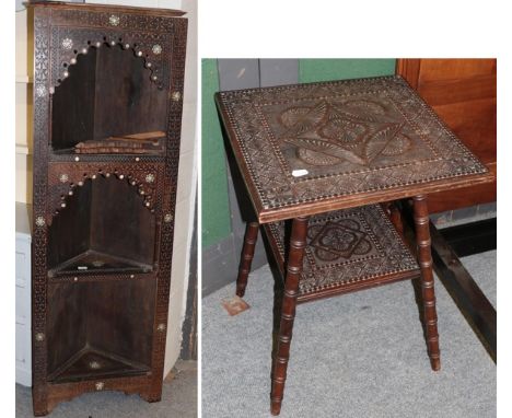 A Moroccan style inlaid and carved standing corner bookcase 63cm by 33cm by 174cm and similar occasional table 47cm square by