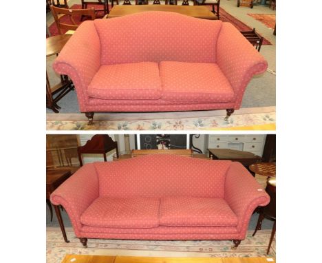 A Laura Ashley three seater hump back sofa in upholstered in red, thistle decorated fabric 205cm long together with a matchin