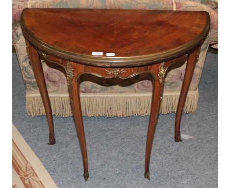 A French brass mounted marquetry inlaid and cross banded king wood demi-lune fold over card table 80cm by 40cm by 75cm.  Surf