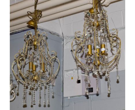 A pair of Venetian style three light lustre drop ceiling lights, 60cms drop