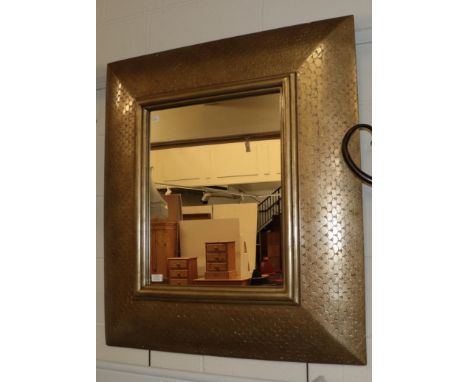 A modern cushion form fish scale decorated mirror 92cm by 101cm