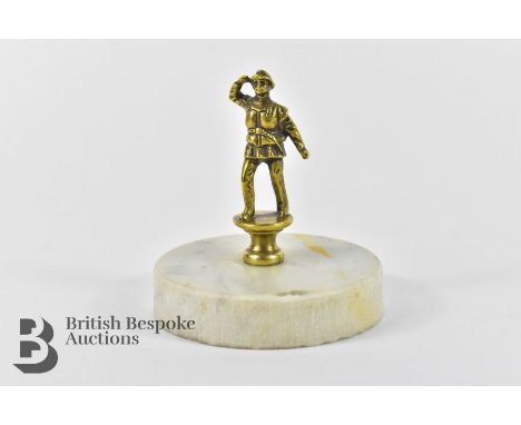 Brass lifeboatman brass mascot in full uniform saluting, for a vintage light car, fitted to a marble display base measuring a