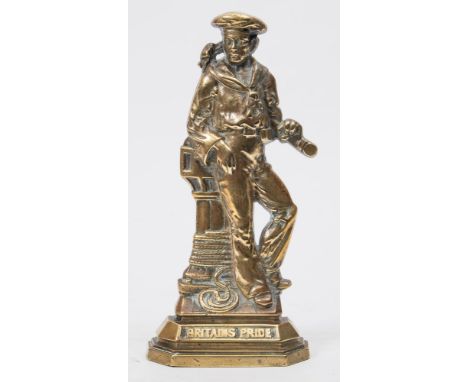 A brass 'Britain's Pride' doorstop:, in the form a sailor holding a telescope standing beside a capstan, 28cm high.