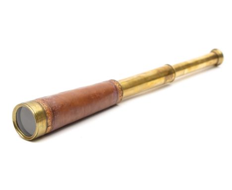 A 'Gibraltar Prison No 2' leather cased brass two draw telescope by Troughton & Simms, London':, the tapering main tube with 