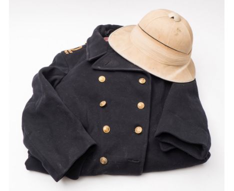 A Royal Navy regulation Great Coat:,  with gilt braided epaulette's and gilt brass buttons and a Wolseley pattern pith helmet