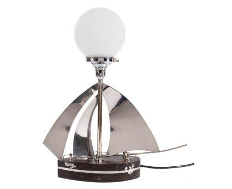 An Art Deco style chrome and bakelite desk lamp in the form of a Yacht 'Rene':, surmounted by a white glass spherical shade, 