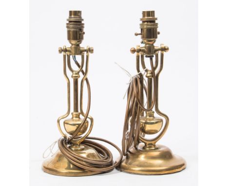 A pair of brass gimbal wall lights:, with later electrical conversion to table lamp bases, 31cm high.