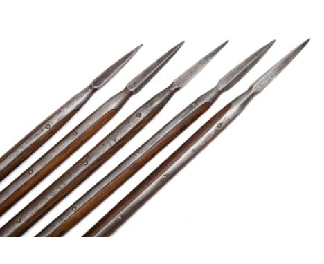 A group of five Admiralty pattern boarding pikes:, with steel tips , wooden shafts and steel mounted butts, two stamped  with