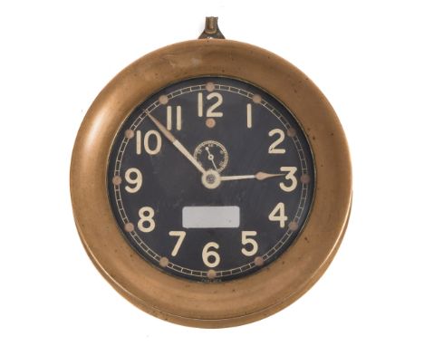 An American brass cased circular bulkhead clock by Chelsea Clock Co, Boston USA:,the black enamel dial signed 'Chelsea below 
