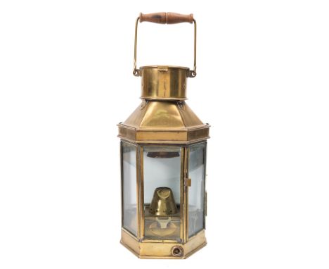 A brass bulkhead oil lamp by Bulpitt & Sons, Birmingham:, stamped as per title to chimney and dated 1941, wooden swing handle