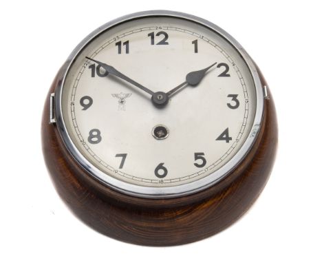 A Kriegsmarine Ward Room clock:, the silvered dial with Arabic numerals  with eagle and swastika over the letter 'M' opposite