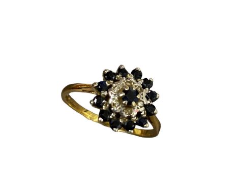 An 18ct yellow gold ladies cluster ring, set with diamonds and sapphires size P, 3.7 grams.