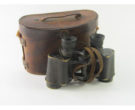 A pair of WWI military binoculars by Aitchinson, London, The Luma, No 18139, cased, impressed 'Case No 2 Prismatic Binocular,