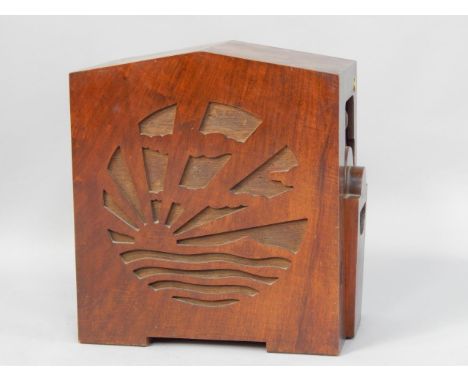 An Art Deco walnut cabinet speaker, with pierced sunburst front and housing a radio receiver FCA 1445 unit with metal rectifi