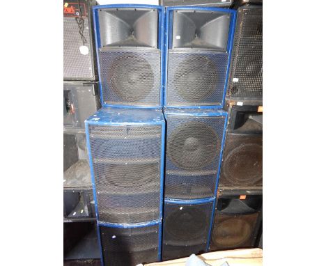 A DB Technologys PA speaker set, comprising four bass enclosures with two angled tops. This lot contains untested or unsafe e
