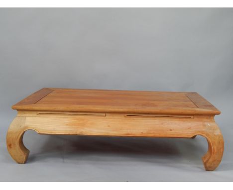 A Chinese hardwood occasional table, of rectangular form raised on scroll legs, 120cm x 80cm x 36cm.