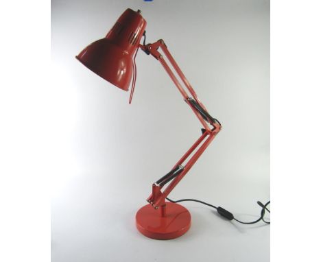 A red anglepoise table lamp, 76cm high extended.