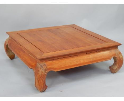 A Chinese hardwood occasional table, of rectangular form raised on scroll legs, 120cm x 80cm x 36cm.