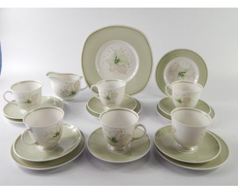 A Susie Cooper porcelain part tea service, floral decorated, comprising bread plate, cream jug, six cups, saucers and plates,