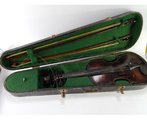 A Stradivarius copy violin (AF), and two bows with nickel mounts, cased