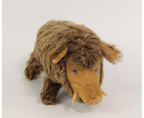 A Steiff 1950's figure of a warthog, with button.