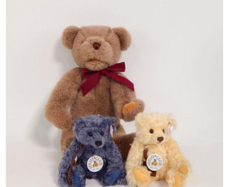 A Steiff blue club bear 2002, another in cream, and a Gund bear, (3).