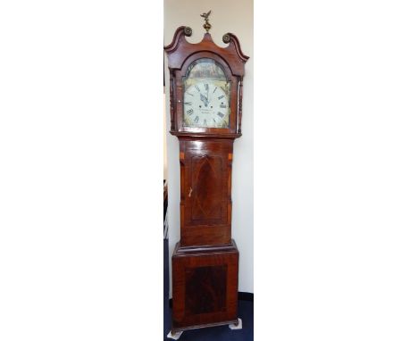 An early 19thC mahogany cased musical longcase clock by Tritschler & Co, Carlisle, the break arch dial painted with a cavalie