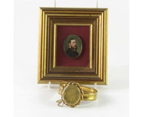 A Victorian portrait miniature of a gentleman, framed, together with a yellow metal Victorian bracelet containing a miniature