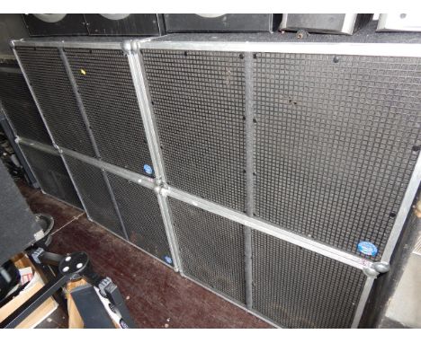 A PA speaker system, with Eminence speakers of custom flight case construction, comprising four base cabinets, two mid range 