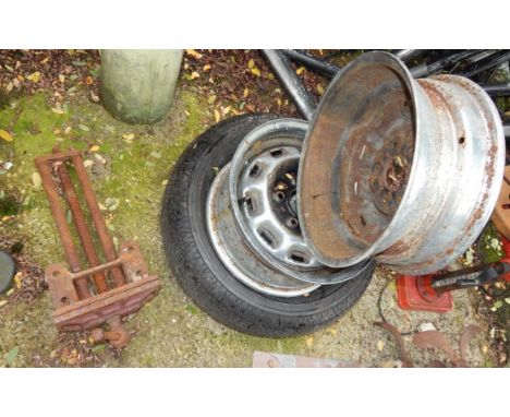 A bench clamp and three wheel hubs.