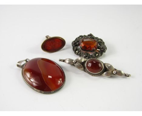 A Regency cornelian Intaglio seal, carved with a classical lady standing against an anchor, set in yellow metal, silver and a