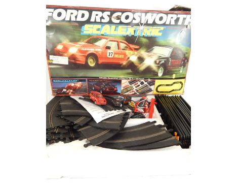 A Scalextric Ford RS Cosworth set, boxed, further track and accessories.