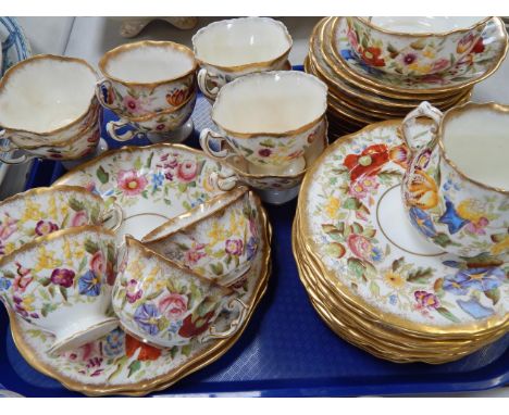 A Hammersley & Co bone china tea service, with polychrome floral decoration and gilt borders, comprising milk jug and sugar b