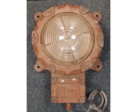 A cast metal bulk head light, 38cm high.