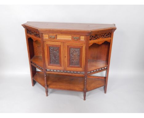 An Edwardian walnut side cabinet by James Shoolbred & Co, with pierced and galleried shelf sides, and centre drawer, stamped 