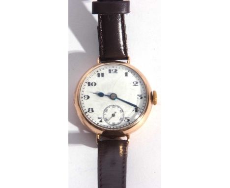 Gents 9ct gold wrist watch with a white enamel dial and contrasting black Arabic numeral hour markers, the inside of the case