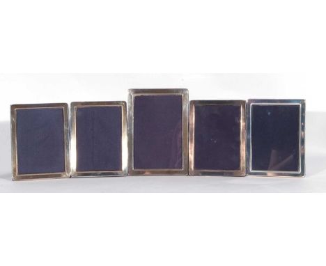 Mixed Lot: set of four modern plain rectangular silver mounted photograph frames with blue velvet easel backs, 15cm x 11cm, a