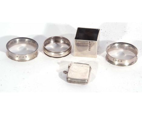 Mixed Lot: heavy square napkin ring, Chester Jubilee hallmark for 1935, pair of slim capstan style napkin rings, Chester 1896
