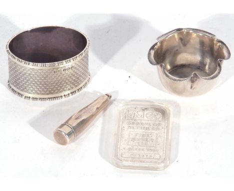 Mixed Lot: Johnson Matthey 1 troy ounce ingot (drilled) in plastic case, single engine turned napkin ring, Birmingham 1933, s