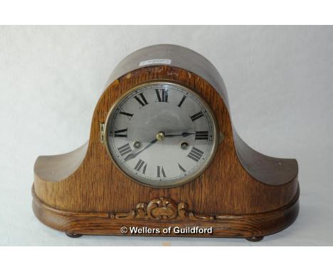 An oak Napoleon hat mantel clock with two train movement.