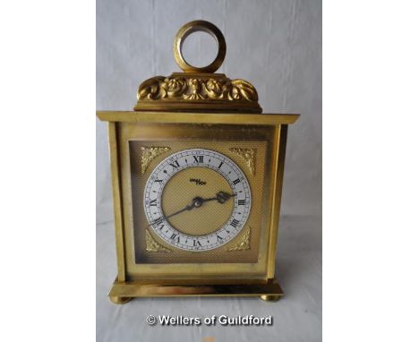 A Swiss made brass mantel clock with silvered chapter ring and Roman numerals, signed IM HOF.