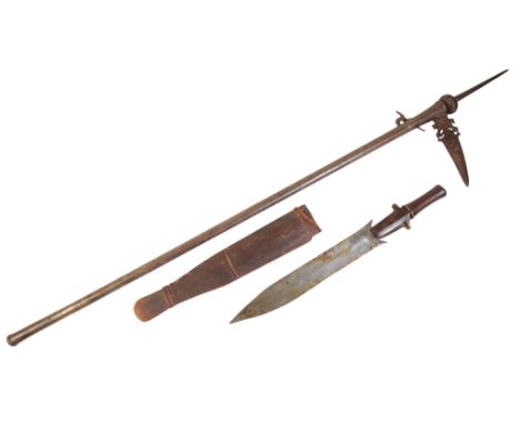 AN 18TH CENTURY STYLE CONTINENTAL AXE and an African dagger with a hardwood grip, in the original wooden scabbard (2)